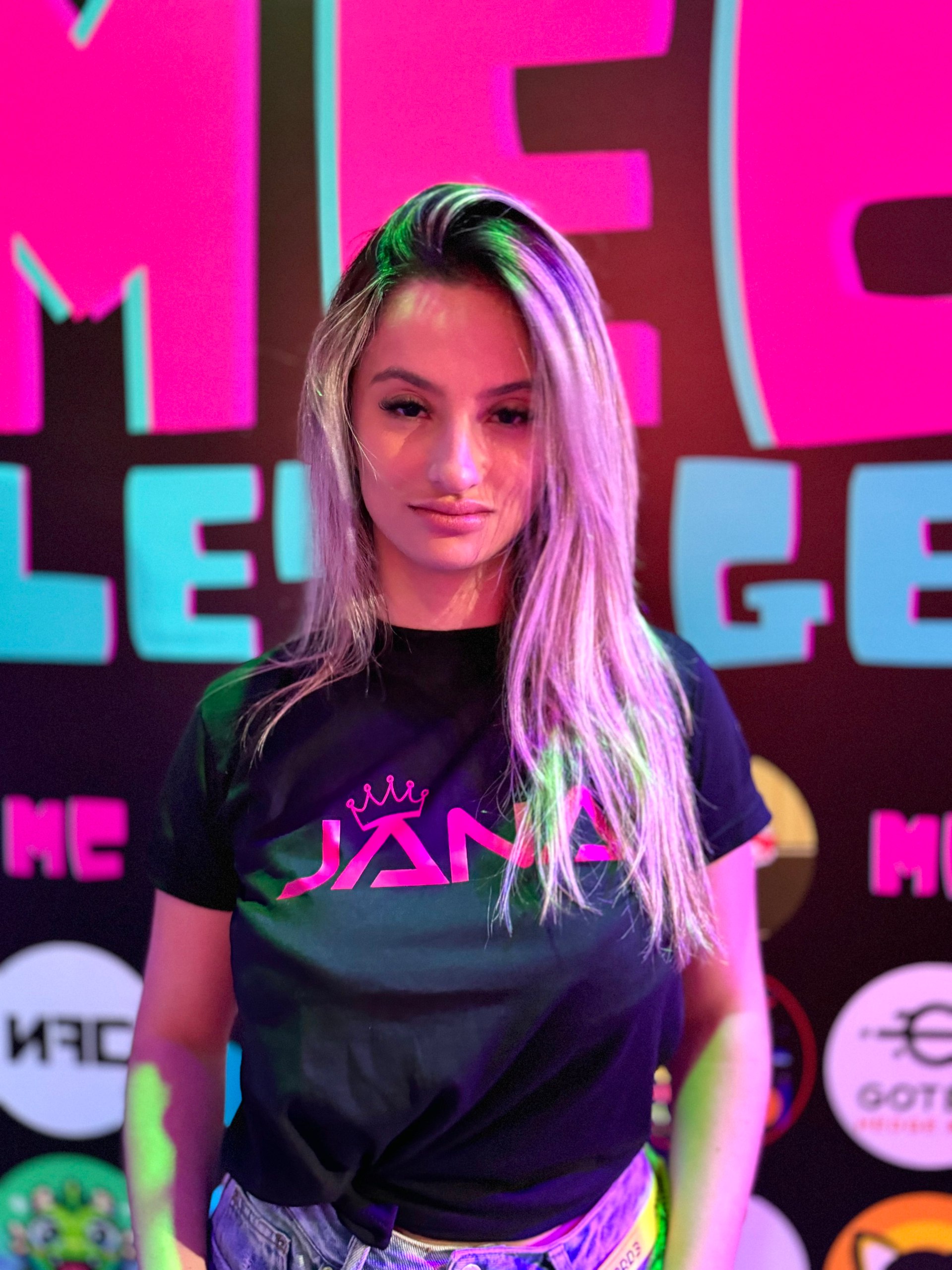 Jana in JANA branded shirt with purple and pink lighting