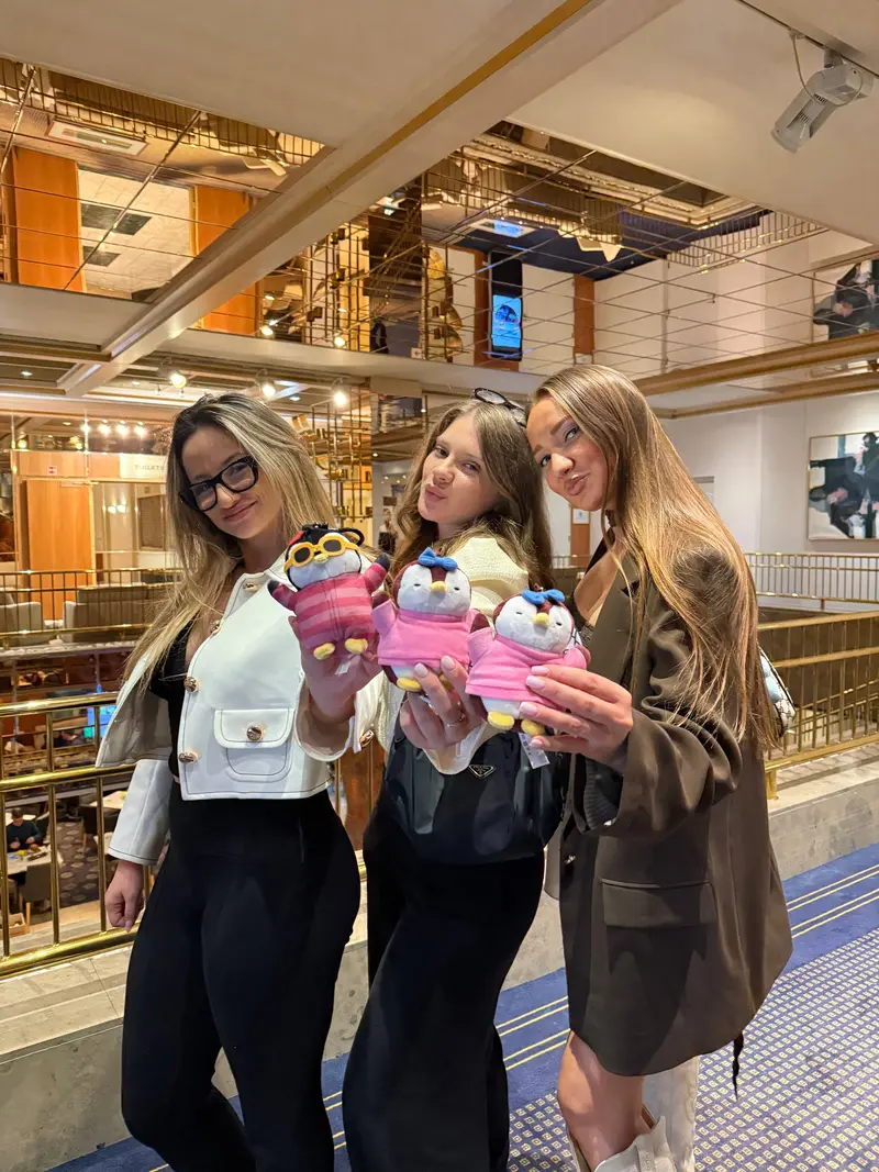 Jana and friends with Pudgy Penguin plushies